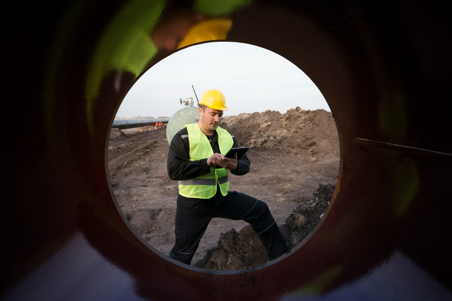 shot-oilfield-worker-checking-quality-gas-pipes-construction-site